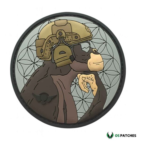Tactical monkey patch wearing helmet, thinking pose with detailed geometric background.