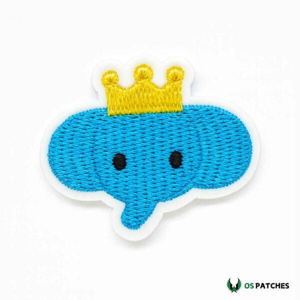 Cute blue elephant patch with yellow crown, perfect for kids’ clothes