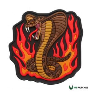 Cobra snake patch with brown body, yellow belly, open fangs, and red flames background