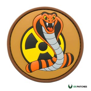 Round cobra snake patch with orange and black body, grey belly, yellow radioactive background, and brown border