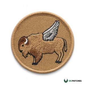 Embroidered patch with flying bison design featuring detailed wings on tan background