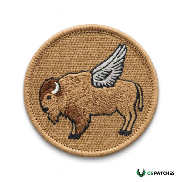 Embroidered patch with flying bison design featuring detailed wings on tan background