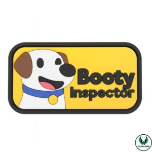 Cartoon PVC patch with smiling dog and bold text booty inspector design