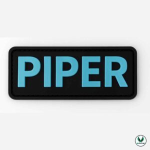 Dog PVC patch with blue text PIPER on black background