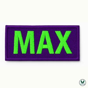 Embroidered dog patch with green text MAX on purple background