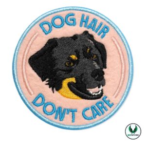 Embroidered patch with black dog face and text dog hair don’t care