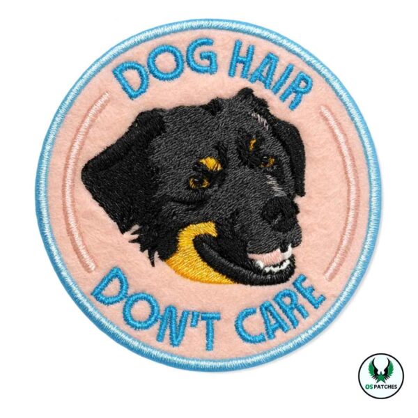 Embroidered patch with black dog face and text dog hair don’t care