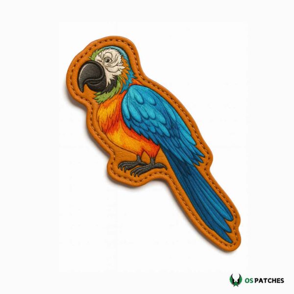 Embroidered leather patch with colorful parrot in blue, orange, green, and black details