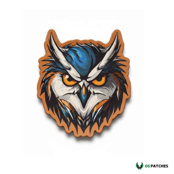 Printed leather patch with fierce owl head design in blue, orange, and white colors