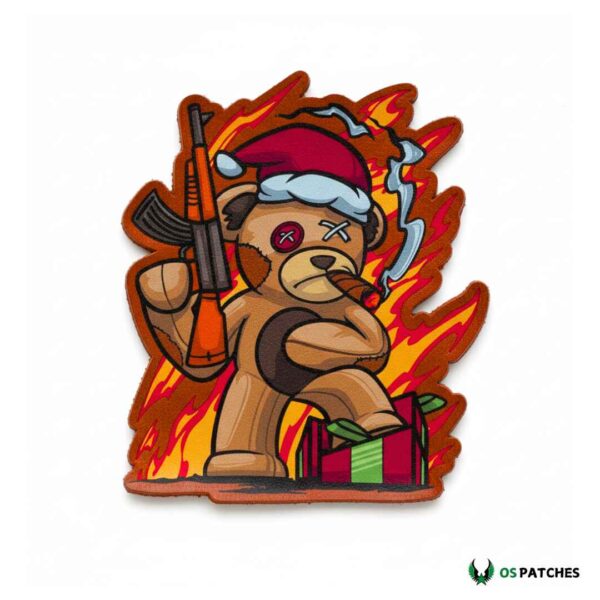 Printed leather patch with teddy bear in Santa hat holding rifle and cigar in fiery background