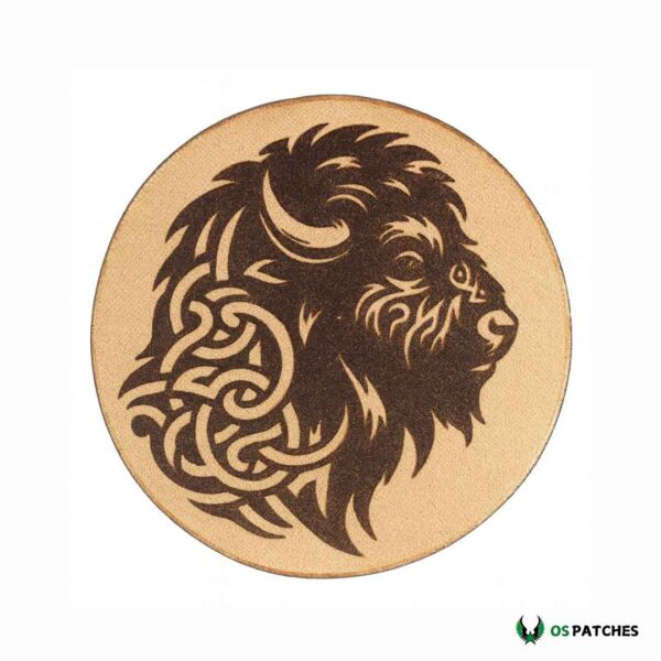 Round leather patch engraved with buffalo head in tribal art style