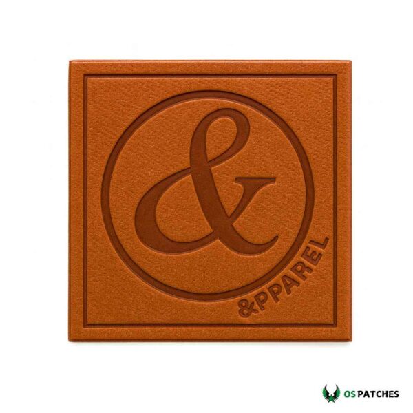 Embossed leather patch with ampersand apparel design